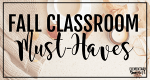 Flat lay of cozy fall items including a candle, warm sweater, coffee cup, and autumn leaves with the text “Fall Classroom Must-Haves.”