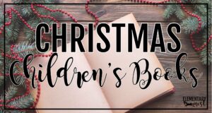 Festive blog header with the text “Christmas Children’s Books” over an open book surrounded by evergreen branches and red bead garland