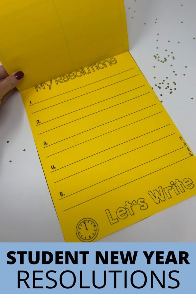 A yellow student writing booklet labeled My Resolutions is opened to a lined page ready for students to write new year goals.